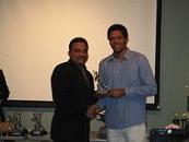 Captain of Lions I, receives Division I Runner-up Trophy from League Chairman